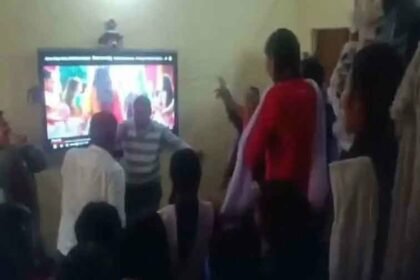 Teachers dance with girl students