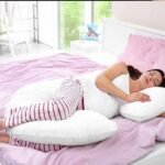 a pillow between your legs while sleeping