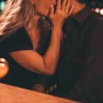 husband-kisses-wife-with-love-after-drinking-alcohol-woman-bites-tongue-till-then