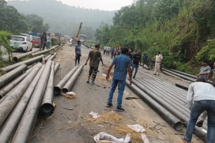 Pipe loaded Trailer Overturned